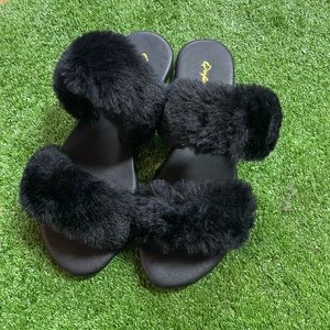 Fuzzy black slip ons size 6